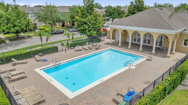 13758 Daniels Landing Cir, Winter Garden, FL 34787 - community pool featuring french doors, a patio area, and fence