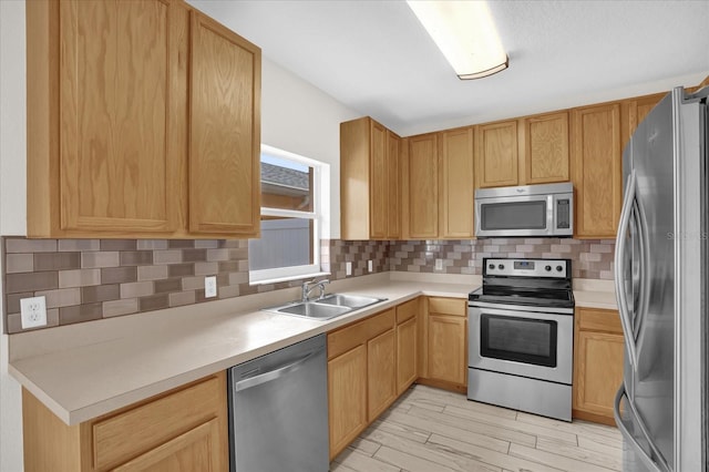 13758 Daniels Landing Cir, Winter Garden, FL 34787 - kitchen with appliances with stainless steel finishes, a sink, decorative backsplash, and light countertops