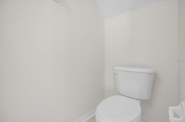 13758 Daniels Landing Cir, Winter Garden, FL 34787 - bathroom featuring baseboards and toilet