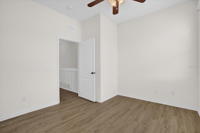 13758 Daniels Landing Cir, Winter Garden, FL 34787 - unfurnished room featuring a ceiling fan, wood finished floors, baseboards, and a smoke detector