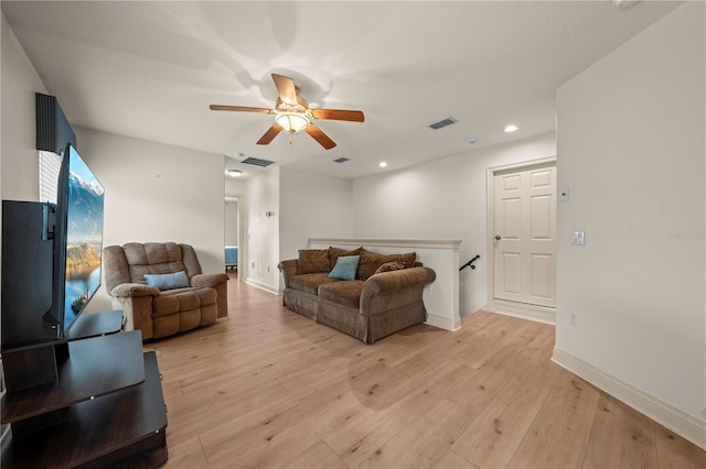 1654 Marina Lake Dr, Kissimmee, FL 34744 - living area featuring a ceiling fan, light wood finished floors, recessed lighting, and baseboards