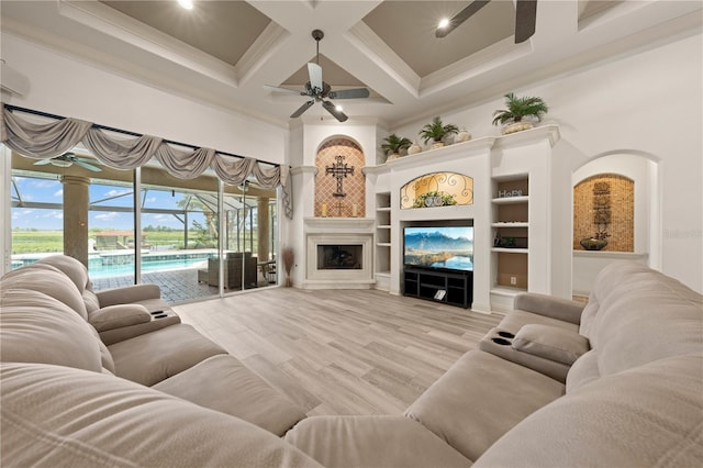 1654 Marina Lake Dr, Kissimmee, FL 34744 - living room featuring ceiling fan, a towering ceiling, crown molding, coffered ceiling, and beam ceiling