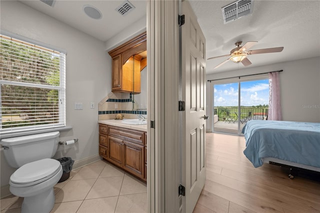 1654 Marina Lake Dr, Kissimmee, FL 34744 - bedroom featuring access to outside, a sink, and a ceiling fan