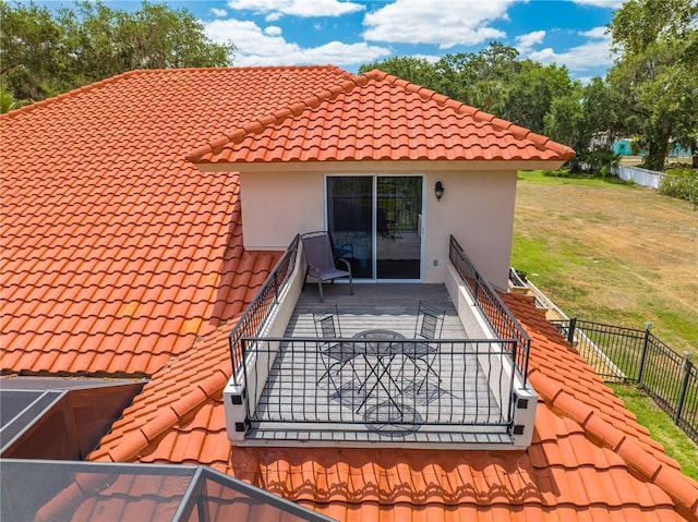 1654 Marina Lake Dr, Kissimmee, FL 34744 - back of house with a tiled roof and stucco siding