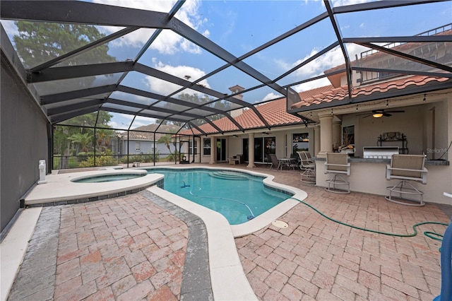 1654 Marina Lake Dr, Kissimmee, FL 34744 - view of swimming pool with an outdoor bar, a ceiling fan, a patio, and glass enclosure