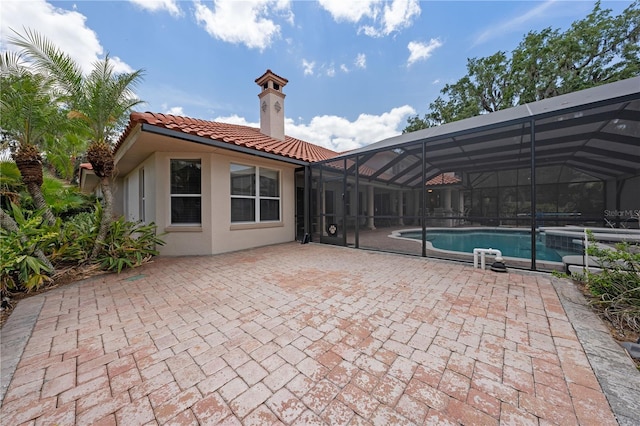 1654 Marina Lake Dr, Kissimmee, FL 34744 - swimming pool with a patio area and glass enclosure