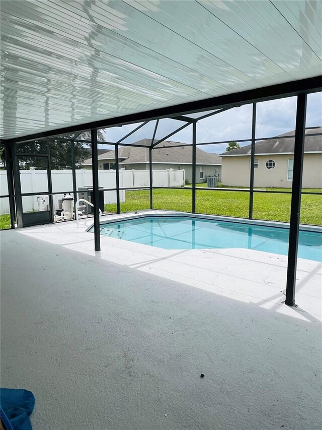 view of pool with a patio area and a lanai