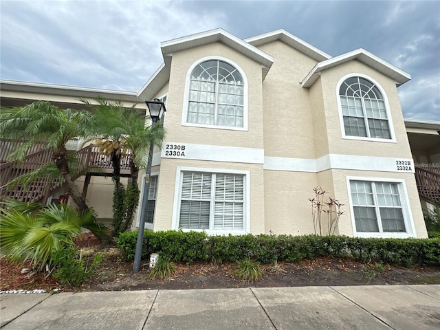 2330 Prime Cir Unit A, Kissimmee, FL 34746 - view of side of home featuring stucco siding