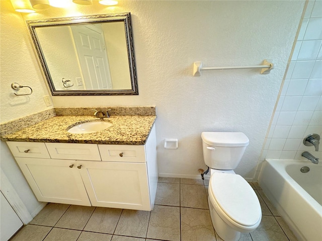 2330 Prime Cir Unit A, Kissimmee, FL 34746 - bathroom featuring toilet, vanity, tile patterned floors, shower / bathtub combination, and a textured wall