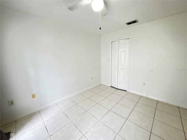 2330 Prime Cir Unit A, Kissimmee, FL 34746 - unfurnished room featuring a ceiling fan, light tile patterned floors, and baseboards