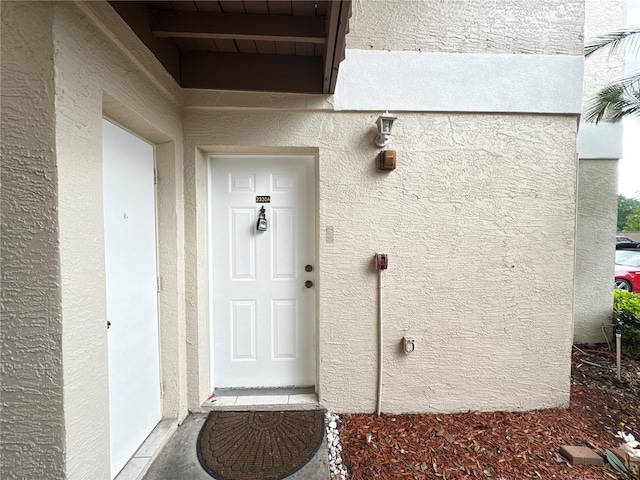 2330 Prime Cir Unit A, Kissimmee, FL 34746 - view of exterior entry with stucco siding