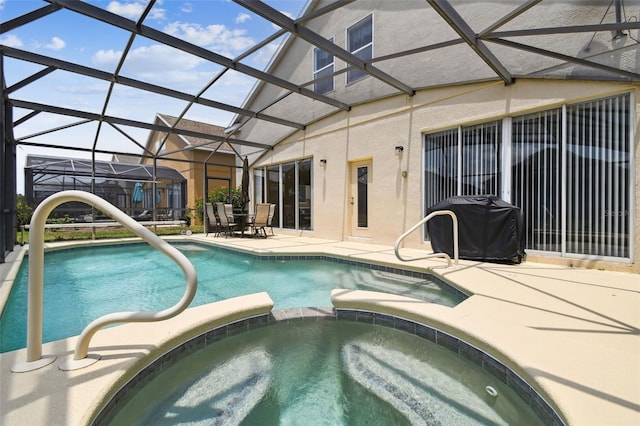 223 Cadiz Loop, Davenport, FL 33837 - view of pool with a patio, a pool with connected hot tub, a lanai, and area for grilling