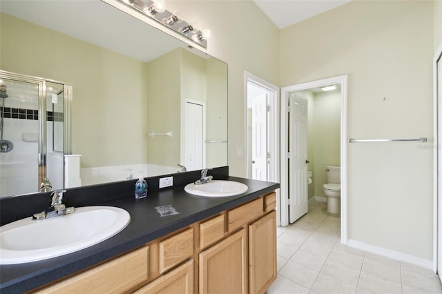 223 Cadiz Loop, Davenport, FL 33837 - full bath with a shower stall, tile patterned floors, toilet, and double vanity