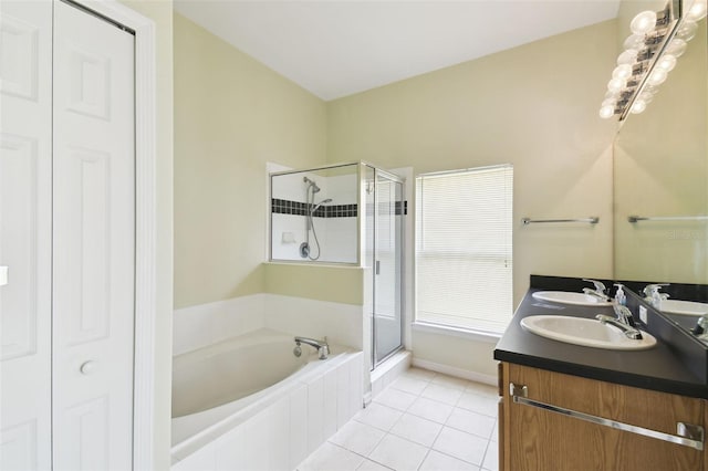 223 Cadiz Loop, Davenport, FL 33837 - full bath featuring a garden tub, tile patterned floors, a stall shower, and double vanity