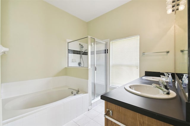 223 Cadiz Loop, Davenport, FL 33837 - bathroom with tile patterned floors, a shower stall, a garden tub, and double vanity