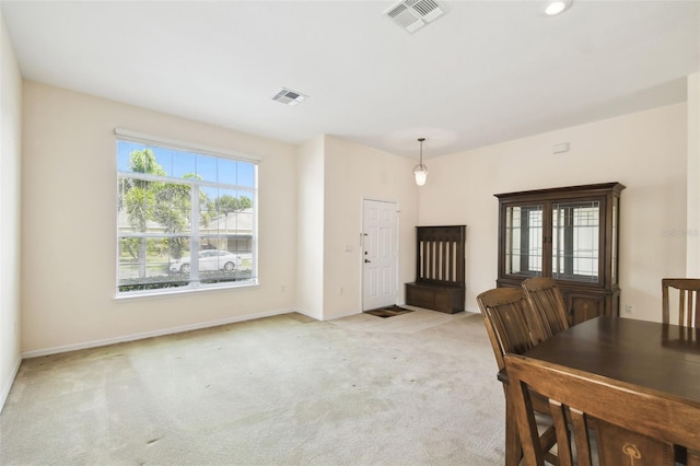 223 Cadiz Loop, Davenport, FL 33837 - unfurnished dining area with light colored carpet and baseboards