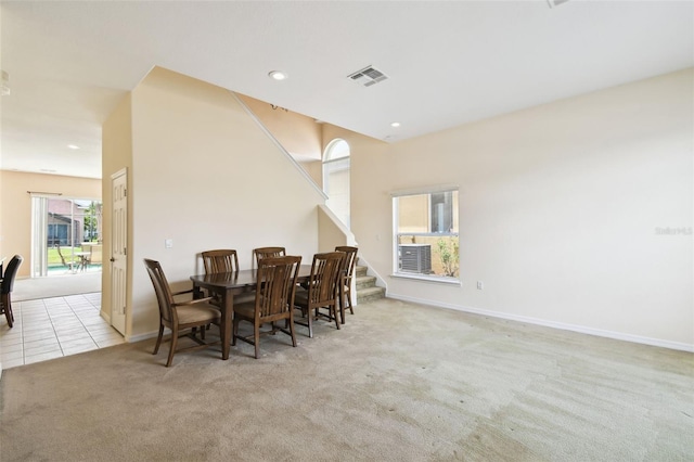 223 Cadiz Loop, Davenport, FL 33837 - carpeted dining area with baseboards, stairway, tile patterned floors, and recessed lighting
