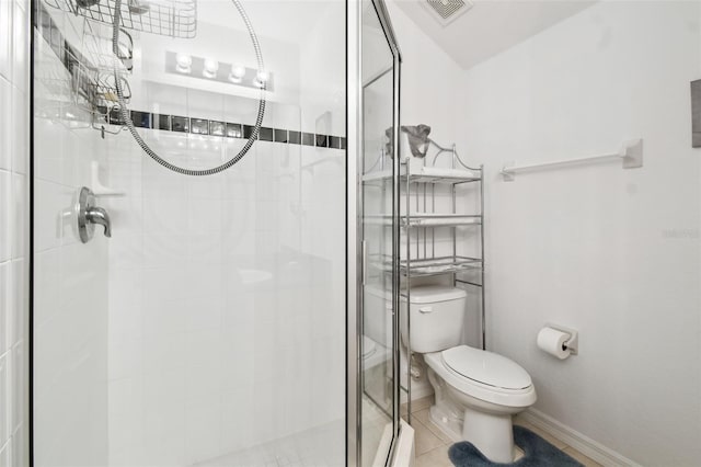 223 Cadiz Loop, Davenport, FL 33837 - full bathroom featuring toilet, a shower stall, baseboards, and tile patterned flooring