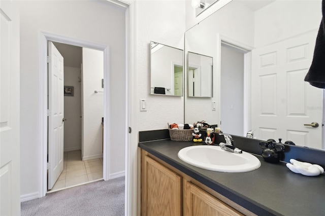 223 Cadiz Loop, Davenport, FL 33837 - bathroom with vanity, baseboards, and tile patterned floors