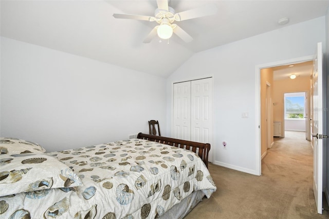 223 Cadiz Loop, Davenport, FL 33837 - bedroom with a closet, light carpet, vaulted ceiling, baseboards, and a ceiling fan