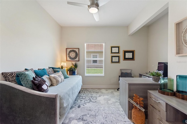 bedroom with ceiling fan and baseboards