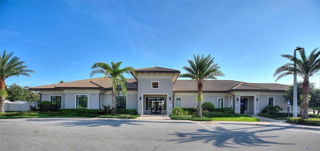 mediterranean / spanish-style house featuring french doors and stucco siding