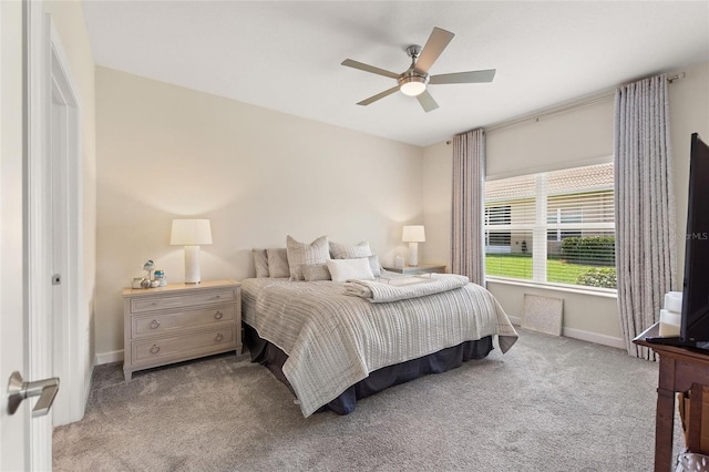 bedroom with carpet flooring, baseboards, and ceiling fan