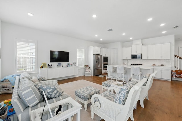 1850 Treasure Cv, Celebration, FL 34747 - living room featuring recessed lighting and dark wood-style flooring