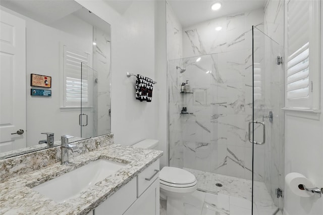 1850 Treasure Cv, Celebration, FL 34747 - full bathroom featuring toilet, a marble finish shower, marble finish flooring, vanity, and recessed lighting