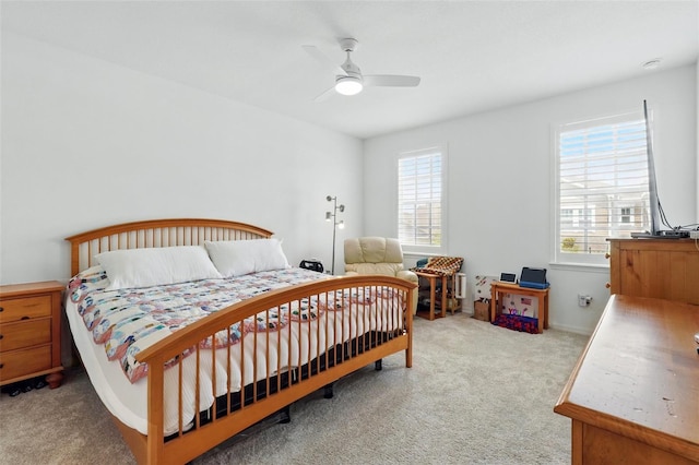 1850 Treasure Cv, Celebration, FL 34747 - carpeted bedroom featuring multiple windows and ceiling fan