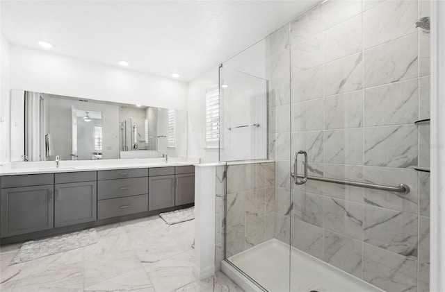 1850 Treasure Cv, Celebration, FL 34747 - full bathroom featuring double vanity, a shower stall, marble look tiles, and recessed lighting