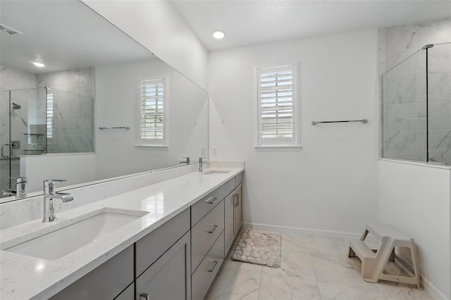 1850 Treasure Cv, Celebration, FL 34747 - full bath with a stall shower, baseboards, marble finish flooring, double vanity, and recessed lighting