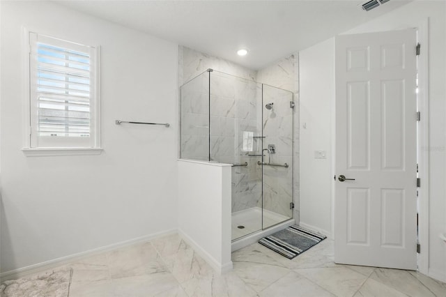 1850 Treasure Cv, Celebration, FL 34747 - bathroom with baseboards, marble finish floors, and a marble finish shower