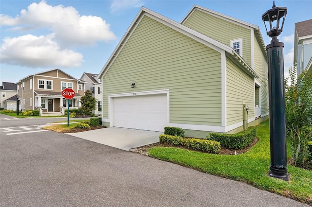 1850 Treasure Cv, Celebration, FL 34747 - view of side of property featuring concrete driveway, a garage, and a residential view