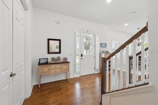 1850 Treasure Cv, Celebration, FL 34747 - foyer with dark wood-type flooring, recessed lighting, and stairway