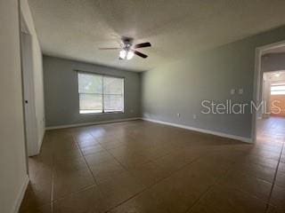 116 Talavera Ln, Kissimmee, FL 34758 - empty room featuring healthy amount of natural light, baseboards, and a ceiling fan