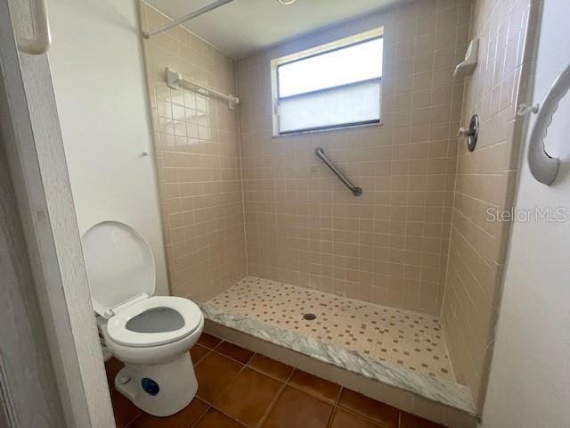 116 Talavera Ln, Kissimmee, FL 34758 - bathroom with tile patterned flooring, a shower stall, and toilet