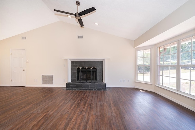 unfurnished living room featuring ceiling fan, dark wood-style floors, a fireplace, baseboards, and high vaulted ceiling