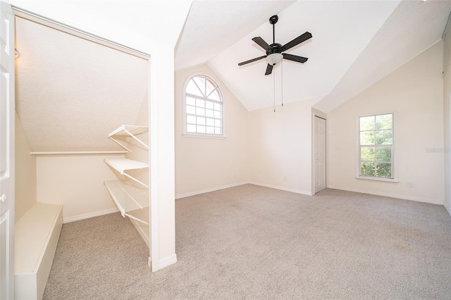 bonus room featuring carpet floors, ceiling fan, vaulted ceiling, plenty of natural light, and baseboards