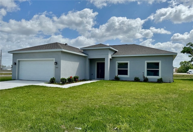 2427 Continental Blvd, Orlando, FL 32808 - prairie-style house featuring stucco siding, an attached garage, a front lawn, driveway, and a shingled roof
