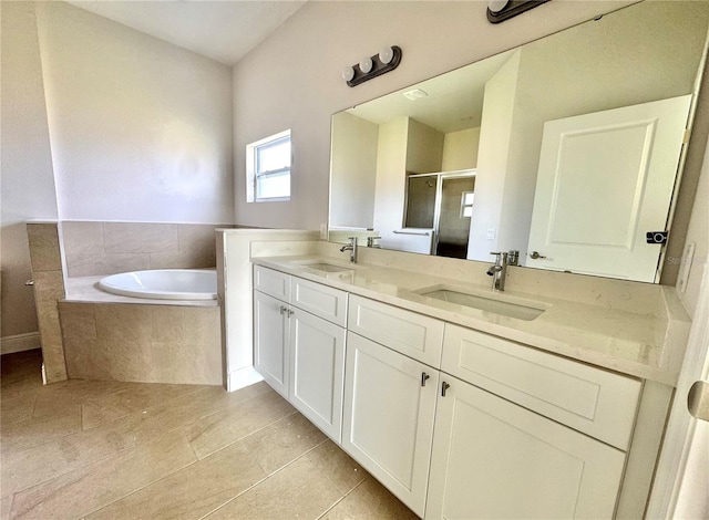 2427 Continental Blvd, Orlando, FL 32808 - bathroom with a shower stall, tile patterned floors, double vanity, and a garden tub