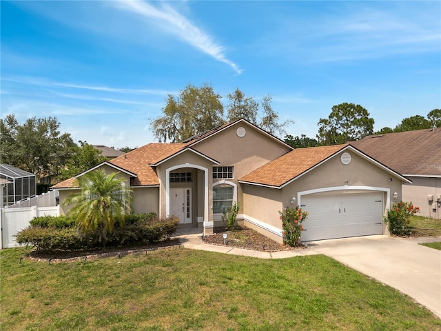 149 Imperial Oak Ct, Davenport, FL 33896 - view of front of home with stucco siding, a garage, concrete driveway, and a shingled roof