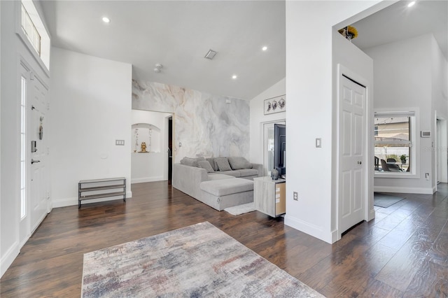 149 Imperial Oak Ct, Davenport, FL 33896 - living area featuring wood finished floors, an accent wall, baseboards, recessed lighting, and lofted ceiling
