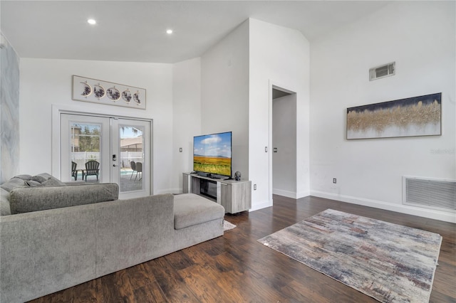 149 Imperial Oak Ct, Davenport, FL 33896 - living area featuring high vaulted ceiling, french doors, baseboards, dark wood finished floors, and recessed lighting