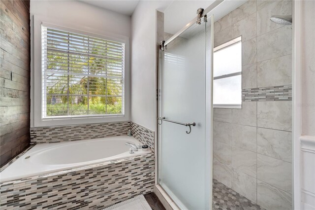 149 Imperial Oak Ct, Davenport, FL 33896 - bathroom with a stall shower and a garden tub