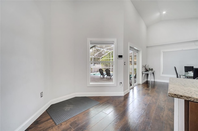 149 Imperial Oak Ct, Davenport, FL 33896 - entryway with dark wood-style flooring, baseboards, and high vaulted ceiling