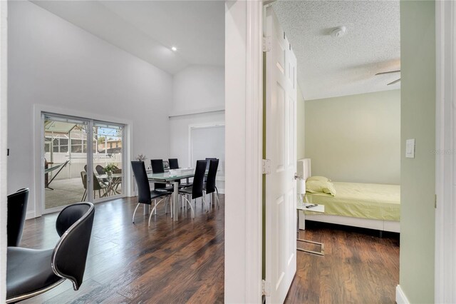 149 Imperial Oak Ct, Davenport, FL 33896 - hallway featuring wood finished floors, high vaulted ceiling, and baseboards