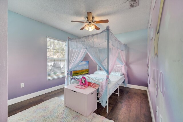 149 Imperial Oak Ct, Davenport, FL 33896 - bedroom featuring baseboards, a textured ceiling, wood finished floors, and ceiling fan