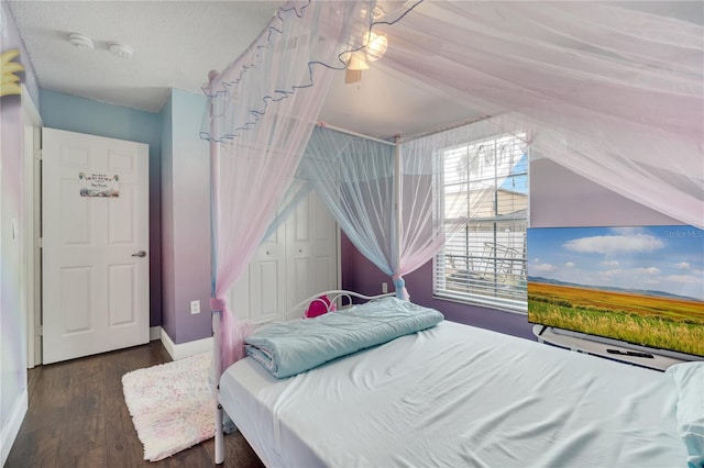 149 Imperial Oak Ct, Davenport, FL 33896 - bedroom with wood finished floors, ceiling fan, and baseboards