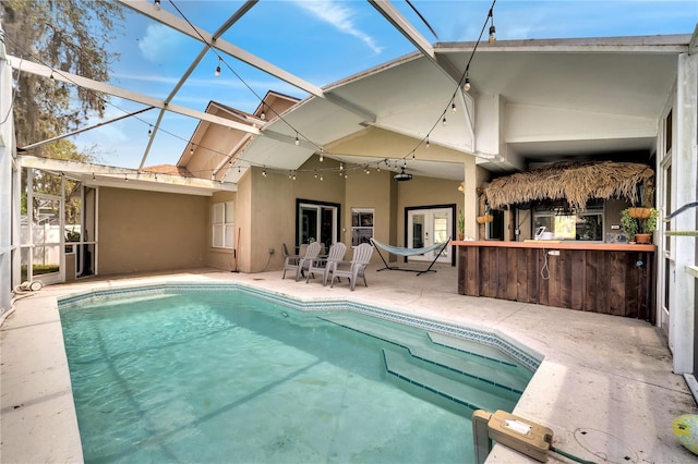 149 Imperial Oak Ct, Davenport, FL 33896 - rear view of house featuring a patio, stucco siding, an outdoor pool, and a lanai
